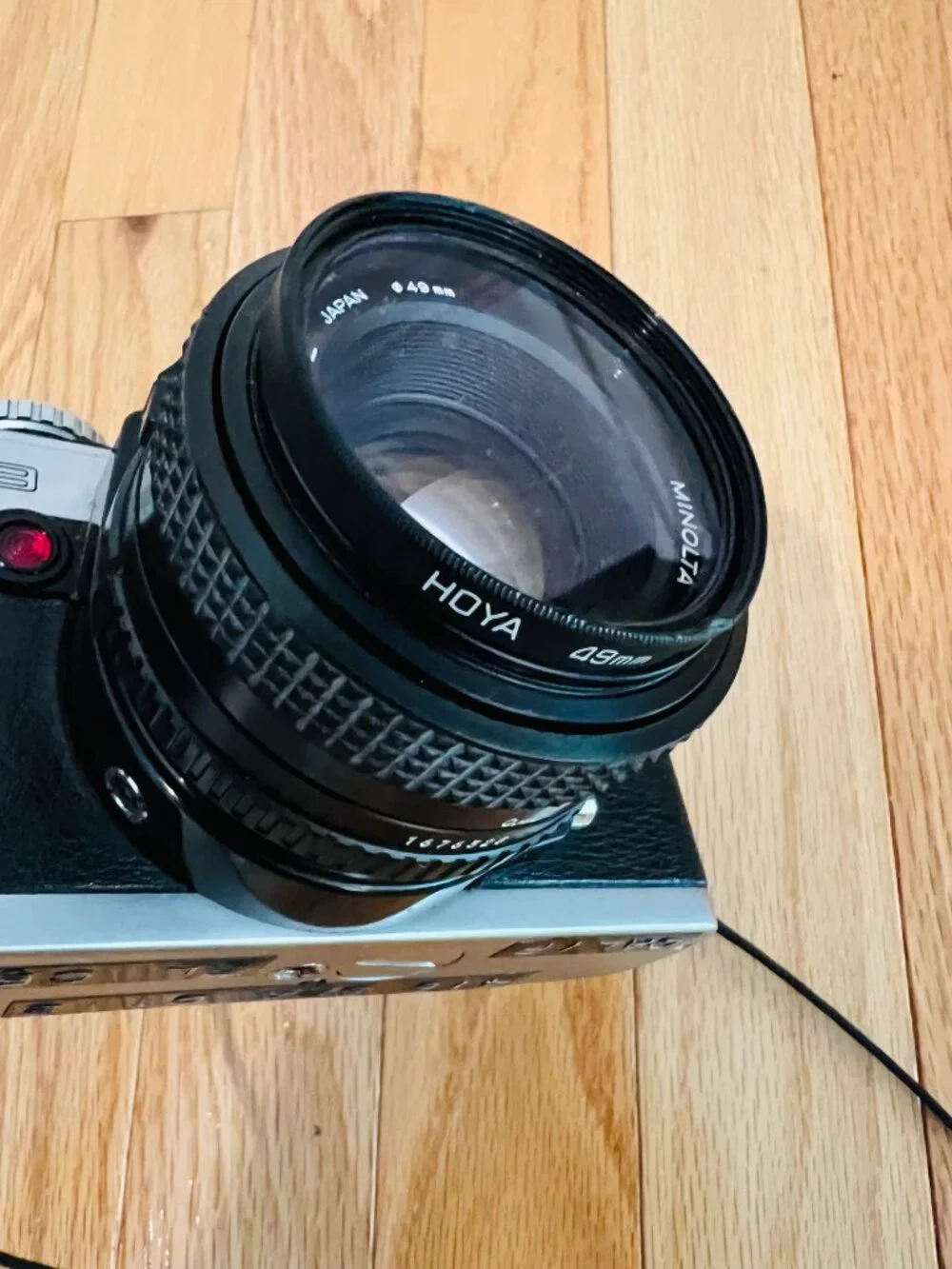 vintage Minolta XG-9 35mm SLR film camera equipped with a 50mm prime lens